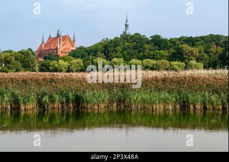 A view at famous castle with cathedral from Vistula lagoon.Astronomer Nicolaus Copernicus lived and worked here in 1521-1543. Frombork, Poland. Stock Photo