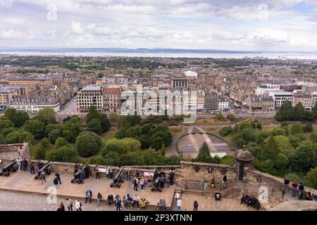 EDINBURGH, SCOTLAND, EUROPE - Aerial view of tourists on Edinburgh Castle wall and New Town in distance. Stock Photo