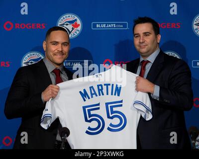 Toronto Blues Jays newly-signed catcher Russell Martin, left, and his father  Russell Martin Sr. smile after a baseball press conference in Toronto,  Thursday, Nov. 20, 2014. (AP Photo/The Canadian Press, Nathan Denette