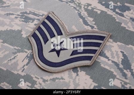 August 31, 2020. US AIR FORCE Staff Sergeant rank patch on digital tiger-stripe pattern Airman Battle Uniform (ABU) Stock Photo