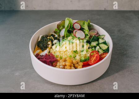Poke bowl with vegetables and cheese. Stock Photo