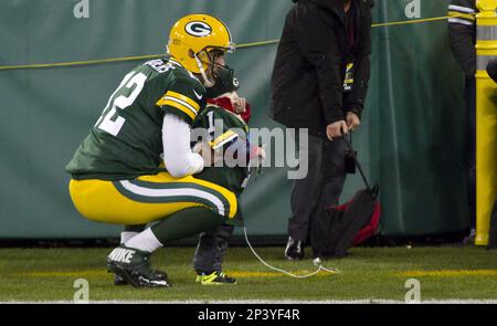 Green Bay Packer quarterback Aaron Rodgers takes a photo with Kellen  Meinke, 3, of Madison before the game against the Chicago Bears at Lambeau  Field on Sunday, Nov. 9 in Green Bay.