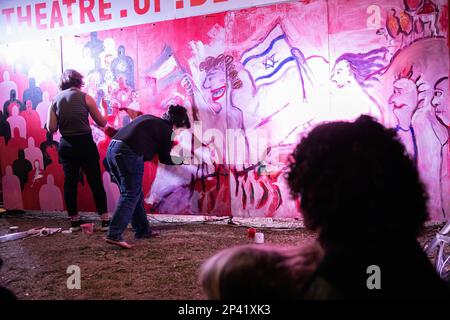 Tel Aviv, Israel. 04th Mar, 2023. Artists paint a mural called the ìTheater of Democracyî with figures waving the Israeli and Palestinian flags during the protest. Over 200,000 people protested in Tel Aviv against Netanyahu's far-right government and its controversial legal reform. Credit: SOPA Images Limited/Alamy Live News Stock Photo