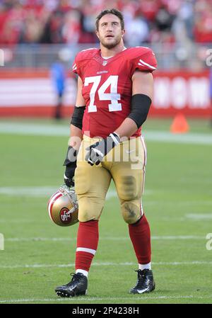 San Francisco 49ers offensive tackle Alfredo Gutierrez (77) carries his  helmet during an NFL football game against the Los Angeles Chargers,  Friday, Aug. 25, 2023, in Santa Clara, Calif. (AP Photo/Scot Tucker