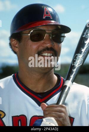 FILE: Reggie Jackson of the California Angels signing an autograph for a  fan before the game. (Sportswire via AP Images Stock Photo - Alamy