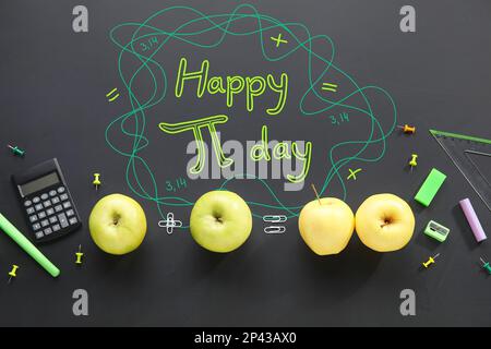 Different school stationery, apples and text HAPPY PI DAY on dark background Stock Photo