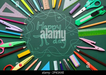 Different school stationery and text HAPPY PI DAY on green background Stock Photo