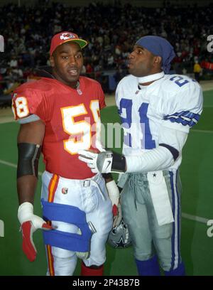 23 NOV 1995: Derrick Thomas (58) of the Kansas City Chiefs and Deion  Sanders (21) of