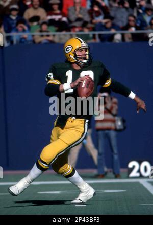 Green Bay quarterback Lynn Dickey listens to head coach Bart Starr