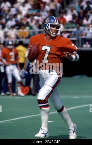 Quarterback John Elway #7 of the Denver Broncos passes the ball down field  against the Los Angeles Raiders.Circa the 1990's. (Icon Sportswire via AP  Images Stock Photo - Alamy