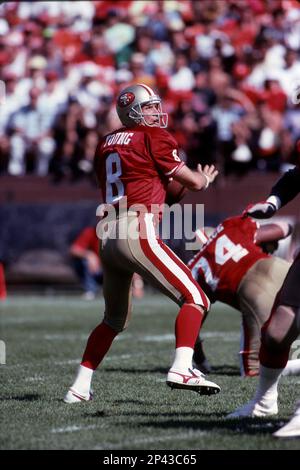 Steve Young #8 of the San Francisco 49ers drops back to pass 