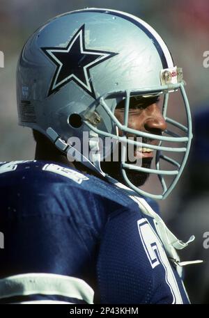 Dallas Cowboys Ed Too Tall Jones talks with the Houston Oilers Earl  Campbell after the game. Football has taken a toll on the body of the  former running back. (Photo by File