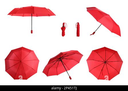 Set with stylish red umbrellas on white background Stock Photo