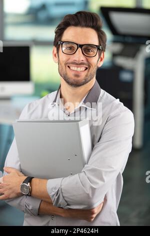 superhero businessman working in the office Stock Photo