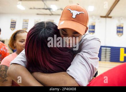 Arthur Hill's basketball star Eric Davis, right, stands with his