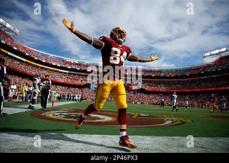 Washington Redskins' Niles Paul celebrates a Tennesee Titans' Dexter  McCluster muffed catch of a punt during the third quarter at FedEx Field in  Landover, Maryland on October 19, 2014. Washington won the