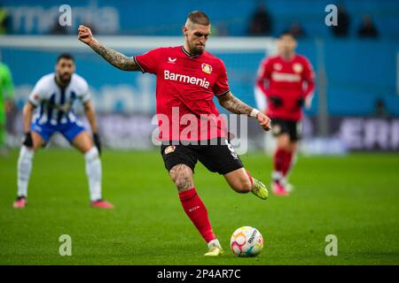 Leverkusen, Germany. 05th Mar, 2023. Soccer: Bundesliga, Bayer Leverkusen - Hertha BSC, Matchday 23, BayArena. Leverkusen's Robert Andrich plays the ball. Credit: Marius Becker/dpa - IMPORTANT NOTE: In accordance with the requirements of the DFL Deutsche Fußball Liga and the DFB Deutscher Fußball-Bund, it is prohibited to use or have used photographs taken in the stadium and/or of the match in the form of sequence pictures and/or video-like photo series./dpa/Alamy Live News Stock Photo