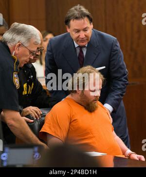 Ronald Lee Haskell collapses as he appears in court on Friday, July 11,  2014, in Houston.