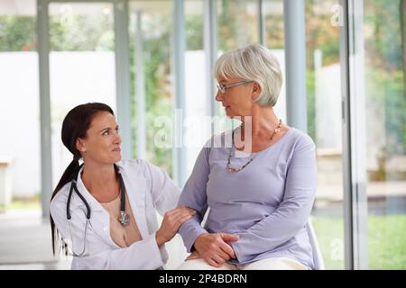 Howre you feeling today. young doctor checking up on her senior patient. Stock Photo