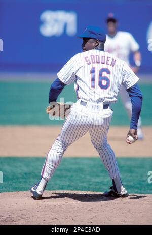 New York Mets Dwight Gooden eyes a pitch before getting a single