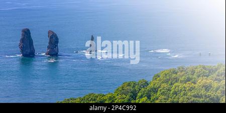 The Three Brothers Rocks in Avacha Bay on Kamchatka Peninsula. Selective focus Stock Photo