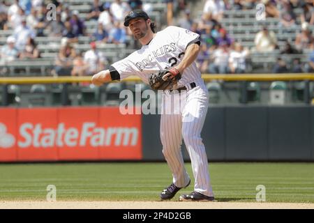 Colorado Rockies shortstop Charlie Culberson (23) makes the throw