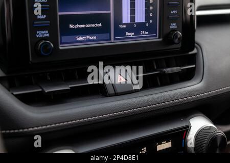 Black plastic block of car control panel with red emergency stop button for signal lights Stock Photo