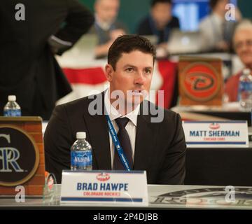 Chicago Cubs pitcher Mark Prior grimaces as he sits on the infield after  being hit on his pitching arm by a line drive off the bat of Colorado  Rockies outfielder Brad Hawpe