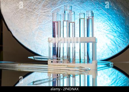 Set of lab test tubes filled with transparent liquid. Lab equipment for medicine reserarch. Stock Photo