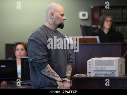 Jared Remy, son of Boston Red Sox baseball broadcaster Jerry Remy, walks  into Middlesex Superior Court