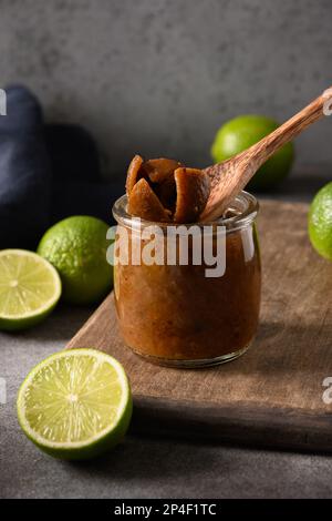 Home made Sri Lankan Lime Pickle of lime, salt, chilli, pepper. Vertical format. Stock Photo