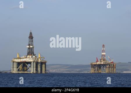 Oil rigs moored in sea near coast, Cromarty Firth, Moray Firth, Invergordon, Easter Ross, Scotland, United Kingdom Stock Photo