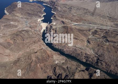 Aerial view of the arch gravity dam on the river, Hoover Dam, Black Canyon, Colorado River, Arizona/Nevada border, U.S.A Stock Photo
