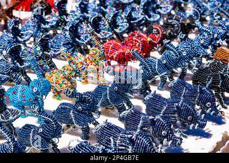 African curios of animals made from beads and wire at street flea market Stock Photo