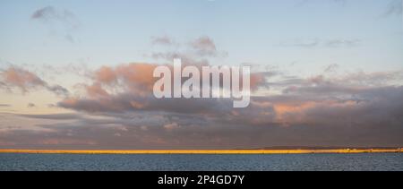 Seascape during dramatic stormy sunset-panorama Stock Photo