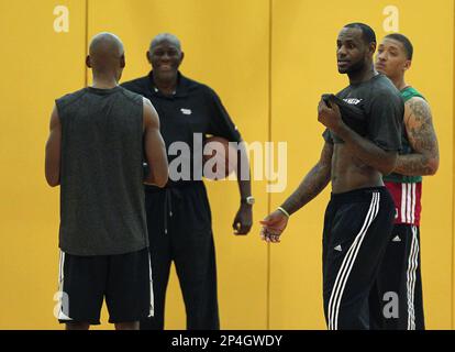 Miami Heat assistant coach Bob McAdoo speaks with Udonis Haslem