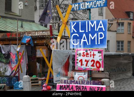 Augsburg, Germany. 06th Mar, 2023. The Augsburg Climate Camp between the Perlachturm and the City Hall. The camp was initiated by Fridays for Future in mid-2020 and is the oldest uninterrupted climate camp in Germany. Credit: Karl-Josef Hildenbrand/dpa/Alamy Live News Stock Photo