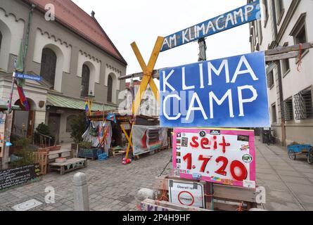 Augsburg, Germany. 06th Mar, 2023. The climate camp between the Perlachturm and the city hall. The camp was initiated by Fridays for Future in mid-2020 and is the oldest uninterrupted climate camp in Germany. Credit: Karl-Josef Hildenbrand/dpa/Alamy Live News Stock Photo