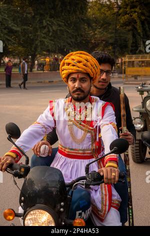 India, Rajasthan, Bikaner, two Rajasthani men on Royal Enfield motorbike Stock Photo