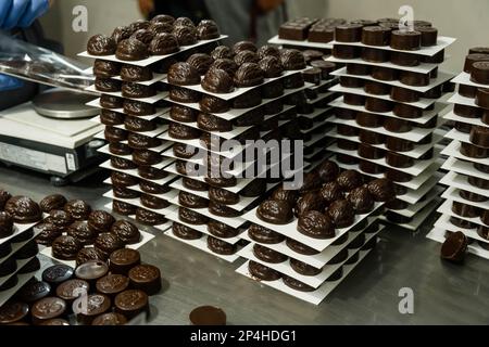 Chocolates in box, various luxury pralines. Chocolate candy making. Stock Photo