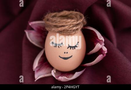 cute sleeping easter chicken egg in middle of tulip petals flowers  Stock Photo
