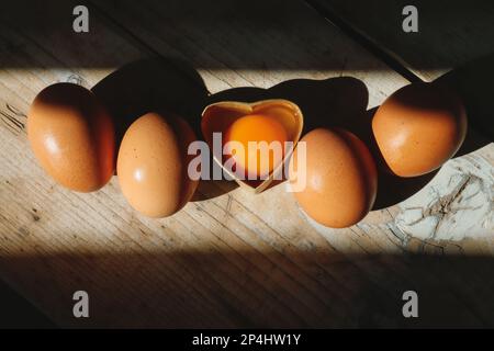 Chicken eggs on the table, yolk and egg white in a box, easter Stock Photo
