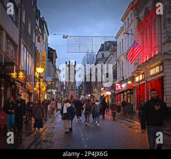 A busy Bold Street at dusk, Liverpool, Merseyside, England, UK, L1 4EZ,  Church of St Luke in the distance - the bombed out church Stock Photo