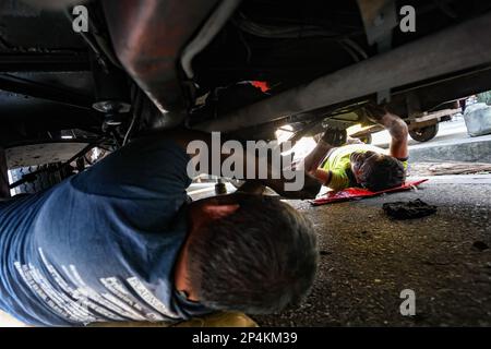 Manila, Manila, The Philippines. 6th Mar, 2023. Two Filipinos repair a jeepney in downtown Manila, amid the nationwide 7-day strike against the government's transport modernisation programme which aims to replace old vehicles. Credit: ZUMA Press, Inc. Credit: ZUMA Press, Inc./Alamy Live News Stock Photo