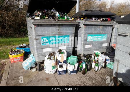 Glass bottles in bins containers and on ground at bottle recycling station in Carmarthenshire Wales UK 2023. KATHY DEWITT Stock Photo