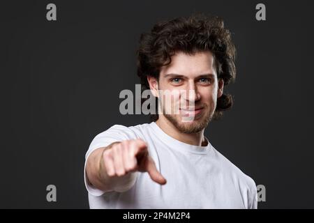amazed caucasian man pointing finger at you Stock Photo