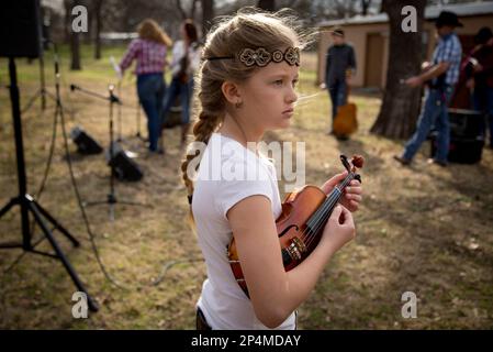 https://l450v.alamy.com/450v/2p4mday/in-this-march-1-2014-photo-london-mccartney-8-tunes-up-her-fiddle-before-rehearsal-in-burelson-texas-the-fiddlers-are-trying-to-preserve-old-time-texas-fiddle-music-a-distinctive-style-once-played-on-front-porches-and-in-living-rooms-ap-photothe-fort-worth-star-telegram-joyce-marshall-mags-out-fort-worth-weekly-360-west-internet-out-2p4mday.jpg