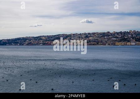 Naples, Italy promenade and city day view. Mergellina coastal section seen from Castel dell’Ovo islet fortress at the gulf of Napoli. Stock Photo