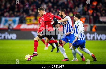 Leverkusen, Germany. 5th Mar, 2023.  Florian Wirtz (Leverkusen), Agustin Rogel (Hertha), Tolga Cigerci (Hertha) Bayer Leverkusen - Hertha BSC Berlin B Stock Photo