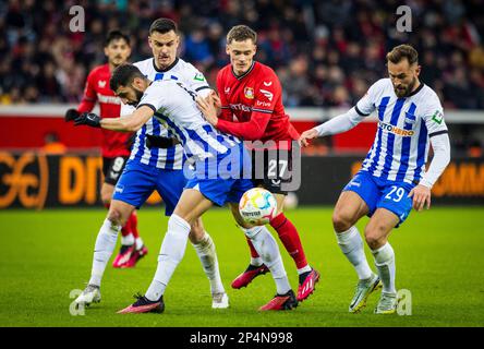 Leverkusen, Germany. 5th Mar, 2023.  Florian Wirtz (Leverkusen), Tolga Cigerci (Hertha), Filip Uremovic (Hertha), Lucas Tousart (Hertha) Bayer Leverku Stock Photo